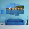 Tropical cabins over water of the Caribbean Sea, multi panel canvas wall art