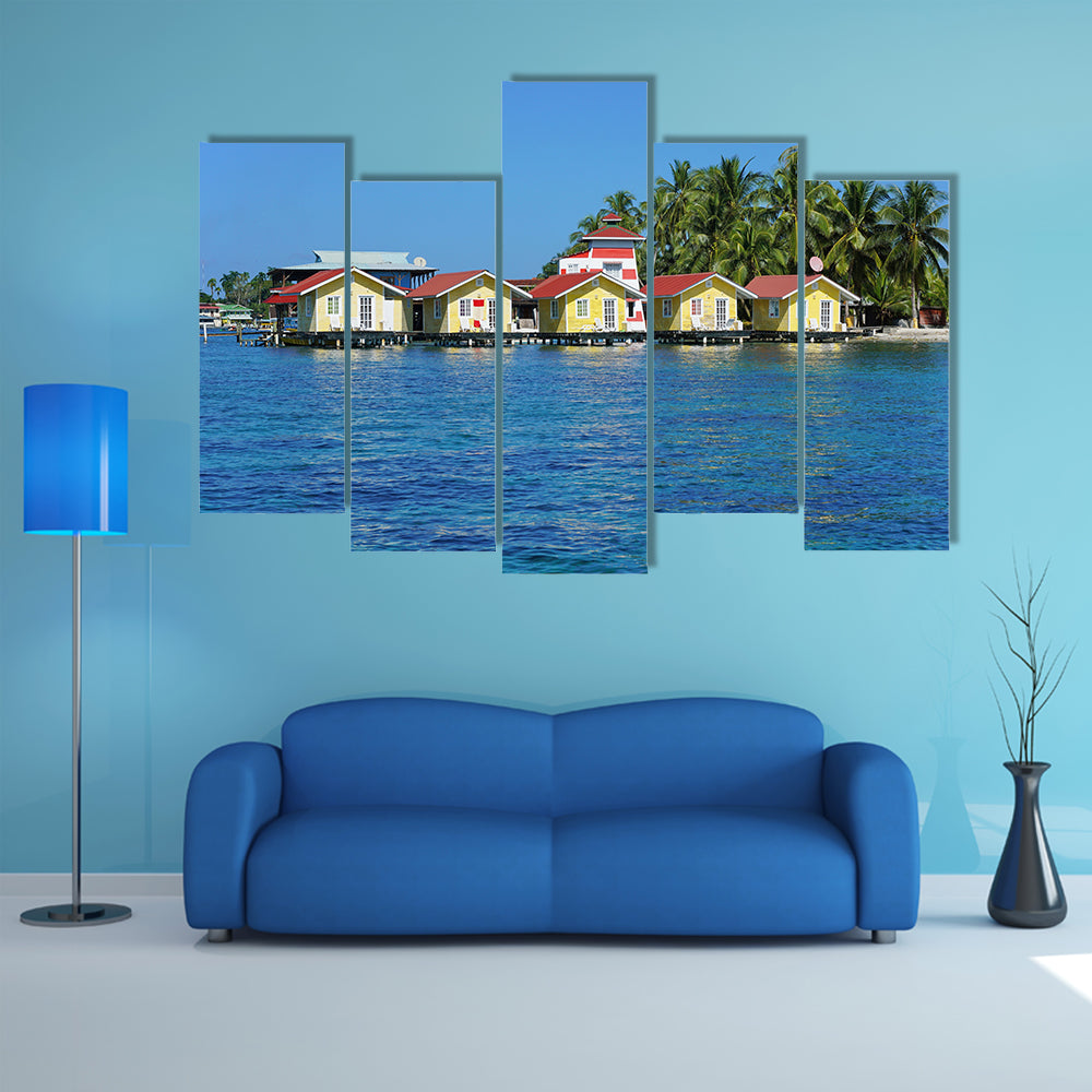 Tropical cabins over water of the Caribbean Sea, multi panel canvas wall art
