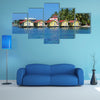 Tropical cabins over water of the Caribbean Sea, multi panel canvas wall art