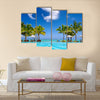 Tropical beach resort with lounge chairs and umbrellas in Mauritius Multi panel canvas wall art