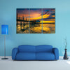 An old floating restaurant view in sunset multi panel canvas wall art