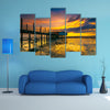 An old floating restaurant view in sunset multi panel canvas wall art