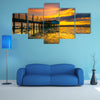 An old floating restaurant view in sunset multi panel canvas wall art