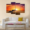 Marine life background - jumping dolphins, beautiful red sunset on sea multi panel canvas wall art