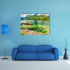 Colorful canoes, kayaks and wooden boats on the alpine lake, Europe multi panel canvas wall art