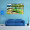 Colorful canoes, kayaks and wooden boats on the alpine lake, Europe multi panel canvas wall art