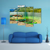 Colorful canoes, kayaks and wooden boats on the alpine lake, Europe multi panel canvas wall art