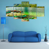 Colorful canoes, kayaks and wooden boats on the alpine lake, Europe multi panel canvas wall art