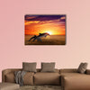 Marine life background - jumping dolphins, beautiful red sunset on sea Multi panel canvas wall art