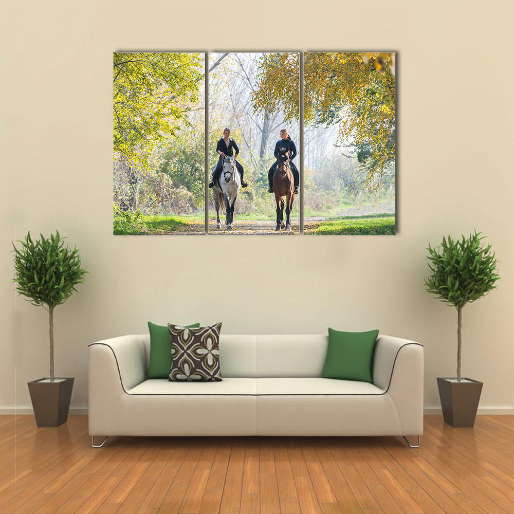 Girls riding a horse on autumn forest multi panel canvas wall art