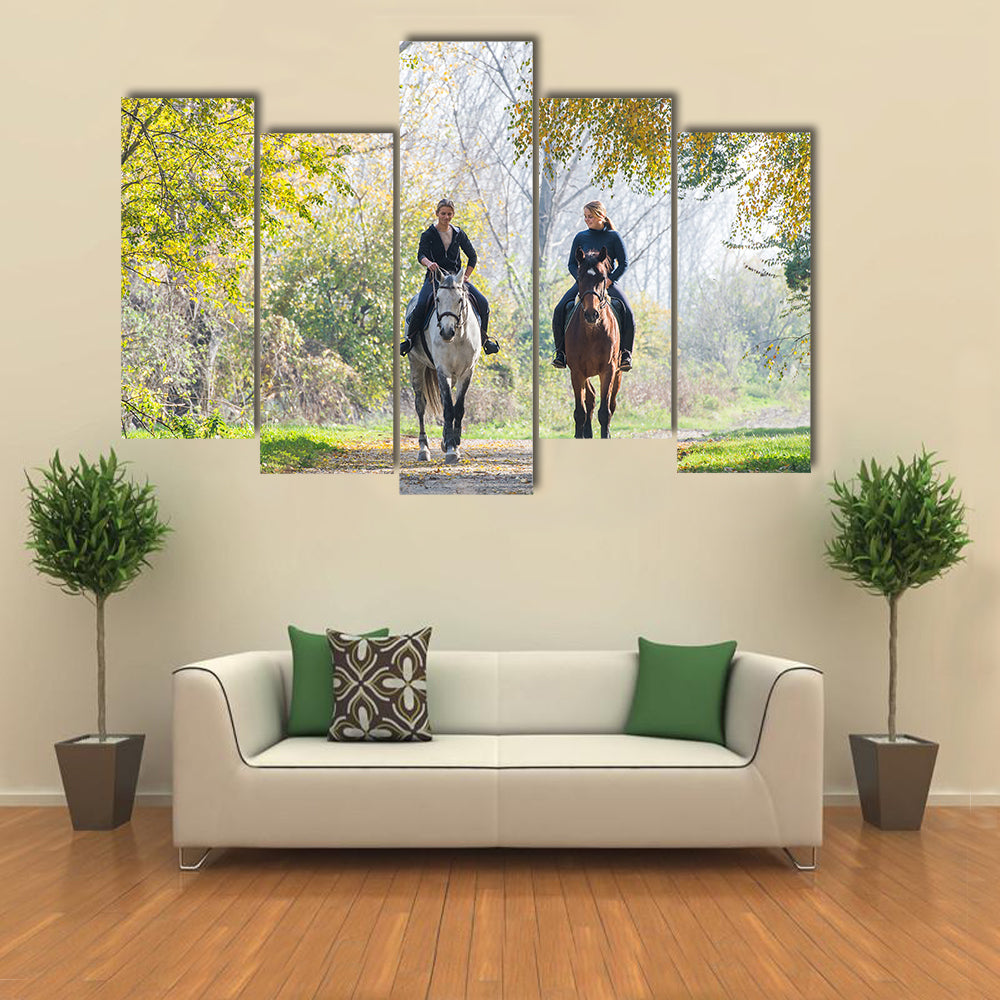 Girls riding a horse on autumn forest multi panel canvas wall art