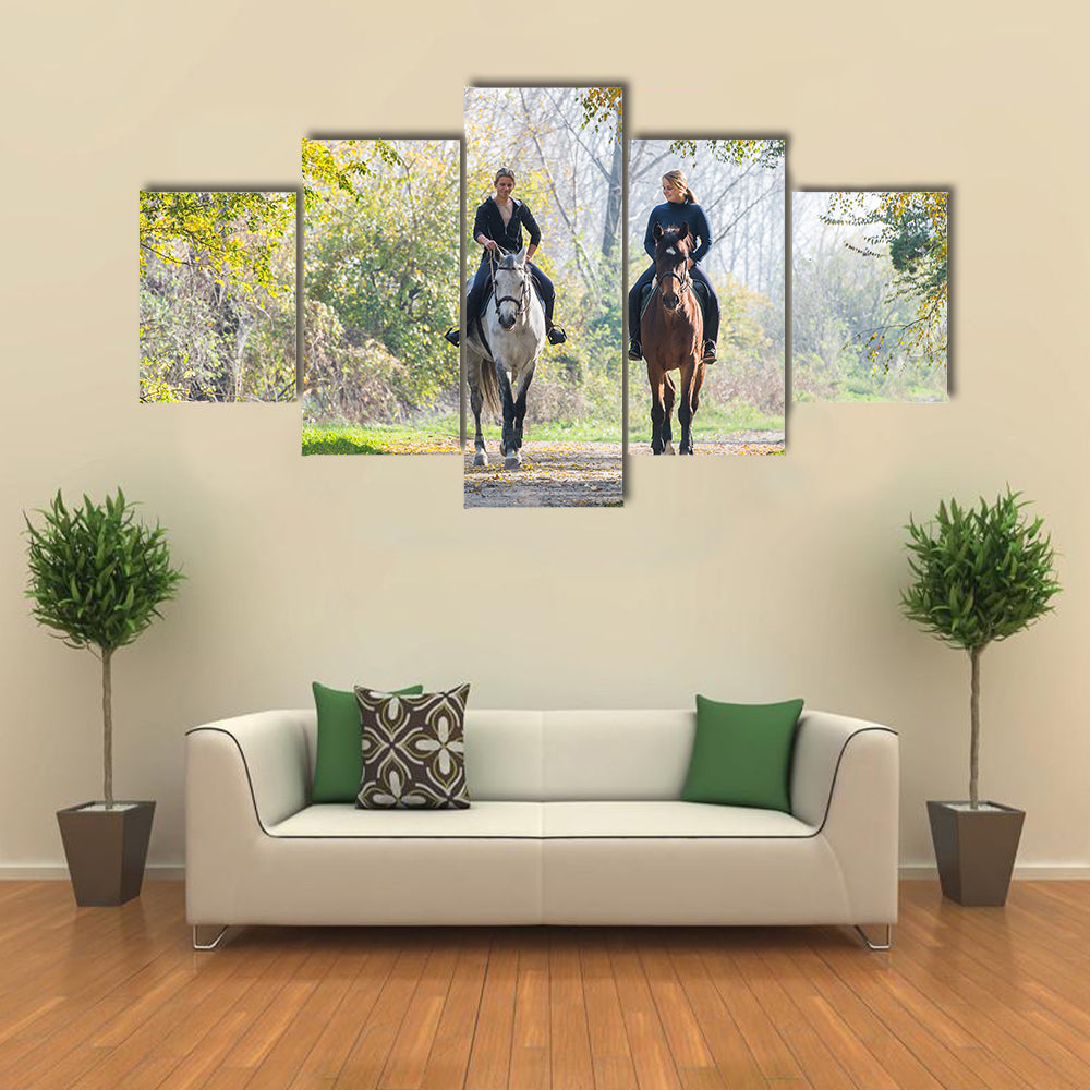 Girls riding a horse on autumn forest multi panel canvas wall art