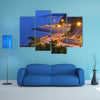 Twilight scene of the road beside mountain and sea multi panel canvas wall art