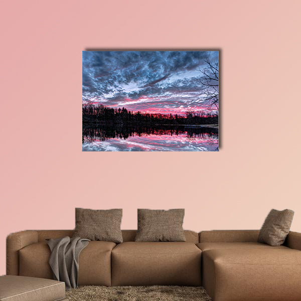 The setting sun paints the sky with dramatic colors that is reflected on a small Indiana pond Multi panel canvas wall art