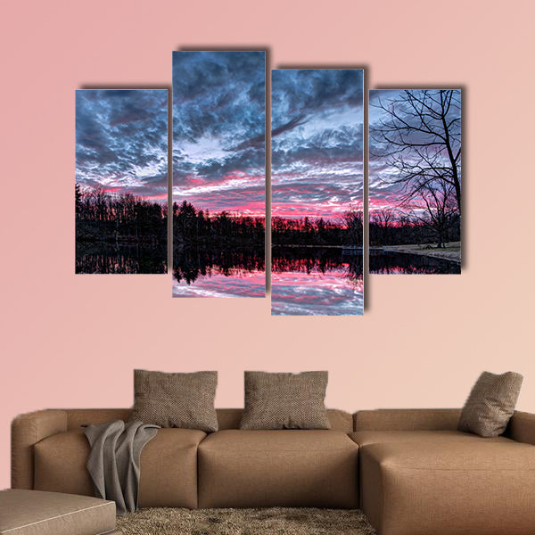 The setting sun paints the sky with dramatic colors that is reflected on a small Indiana pond Multi panel canvas wall art
