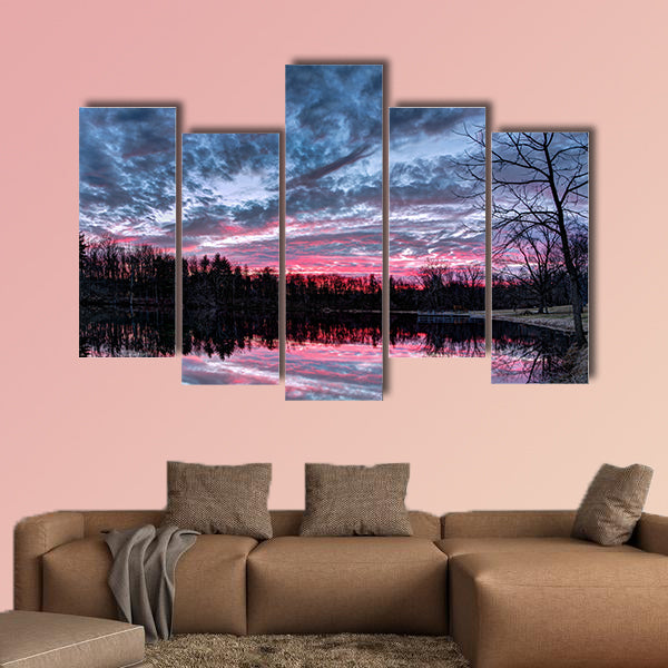 The setting sun paints the sky with dramatic colors that is reflected on a small Indiana pond Multi panel canvas wall art