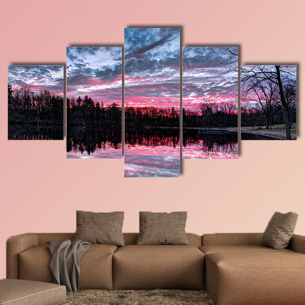 The setting sun paints the sky with dramatic colors that is reflected on a small Indiana pond Multi panel canvas wall art