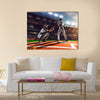 Soccer player in action on night stadium background panorama Multi Panel Canvas Art