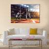 Soccer player in action on night stadium background panorama Multi Panel Canvas Art