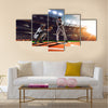 Soccer player in action on night stadium background panorama Multi Panel Canvas Art