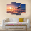 Passenger plane above the clouds multi panel canvas wall art