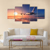 Passenger plane above the clouds multi panel canvas wall art