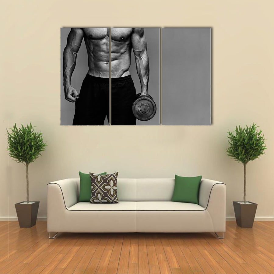 Close up of muscular bodybuilder guy doing exercises with weights over grey background