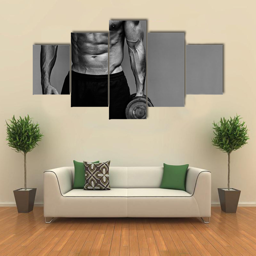 Close up of muscular bodybuilder guy doing exercises with weights over grey background
