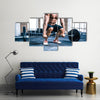 Close up portrait of a muscular man workout with barbell at gym, Multi panel canvas wall art