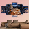 Gingerbread church on snowy Christmas night multi panel canvas wall art