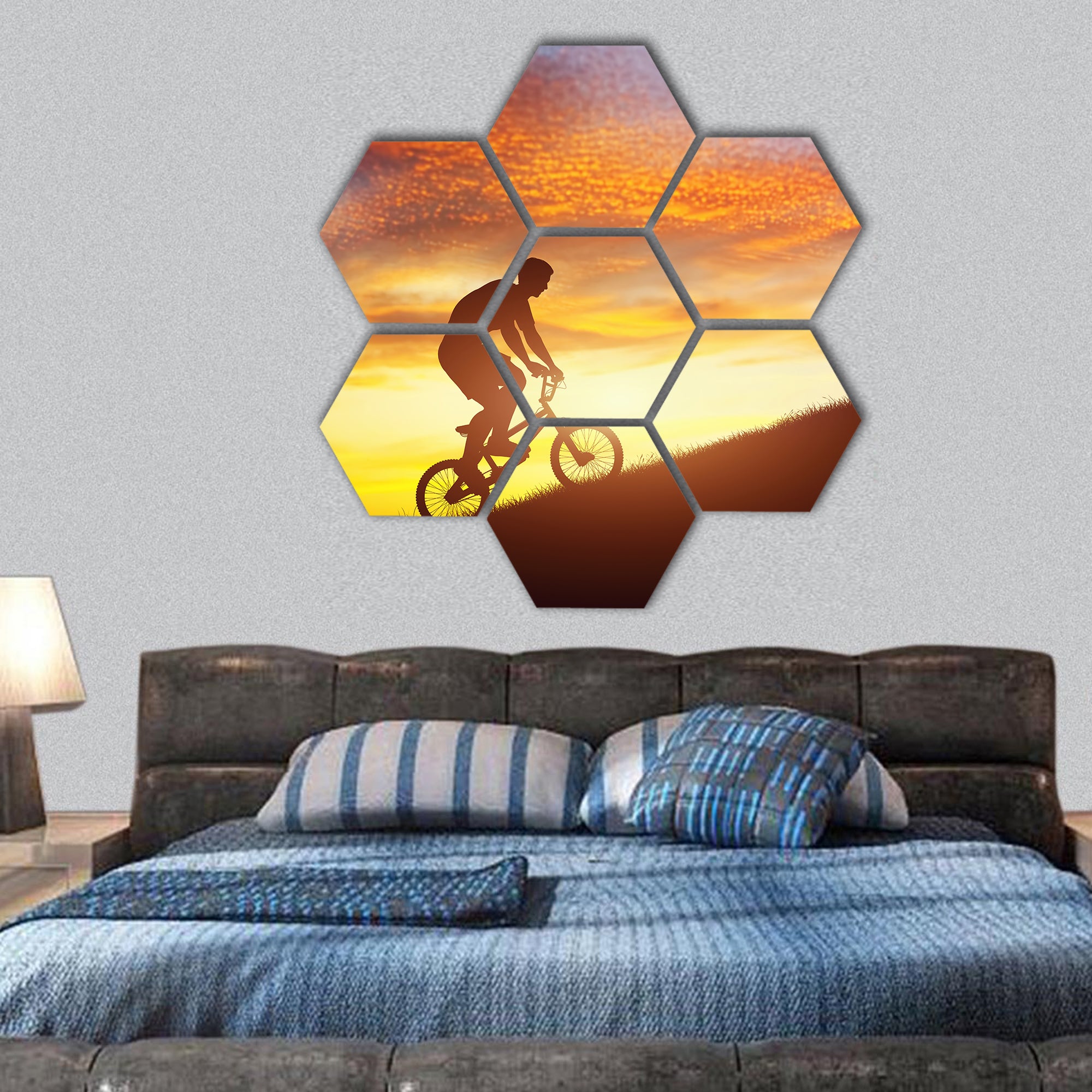 Man riding a bmx bike uphill against sunset sky hexagonal canvas wall art