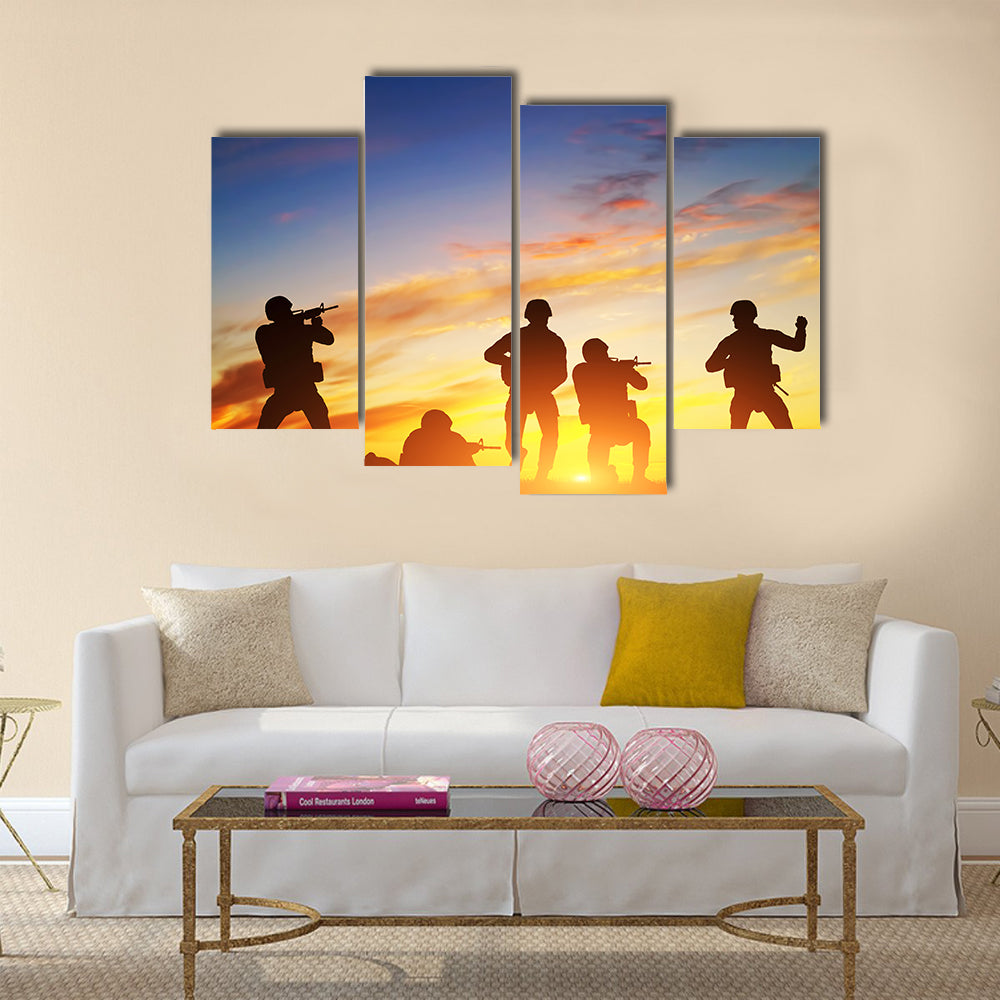 Soldiers in assault shooting with weapon, rifle at sunset. War, army, military Multi Panel Canvas Wall Art