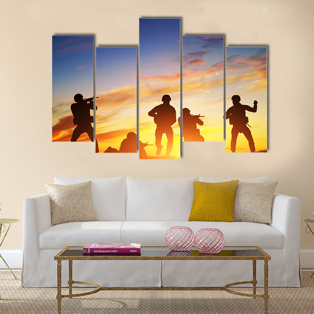 Soldiers in assault shooting with weapon, rifle at sunset. War, army, military Multi Panel Canvas Wall Art