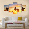 Soldiers in assault shooting with weapon, rifle at sunset. War, army, military Multi Panel Canvas Wall Art