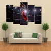 Basketball player in action Multi panel canvas wall art