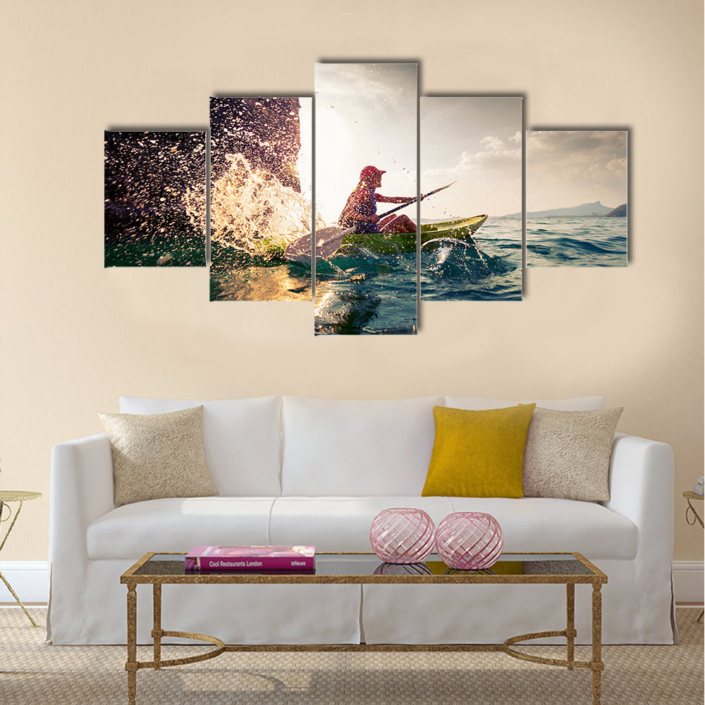 Woman with the kayak multi panel canvas wall art