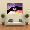 Silhouette hand in heart shape and beautiful sky multi panel canvas wall art