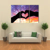 Silhouette hand in heart shape and beautiful sky multi panel canvas wall art