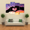 Silhouette hand in heart shape and beautiful sky multi panel canvas wall art