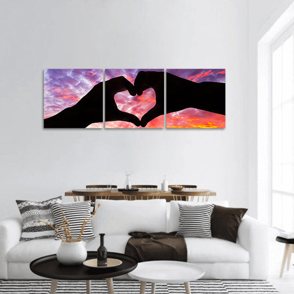 Silhouette hand in heart shape and beautiful sky panoramic canvas wall art