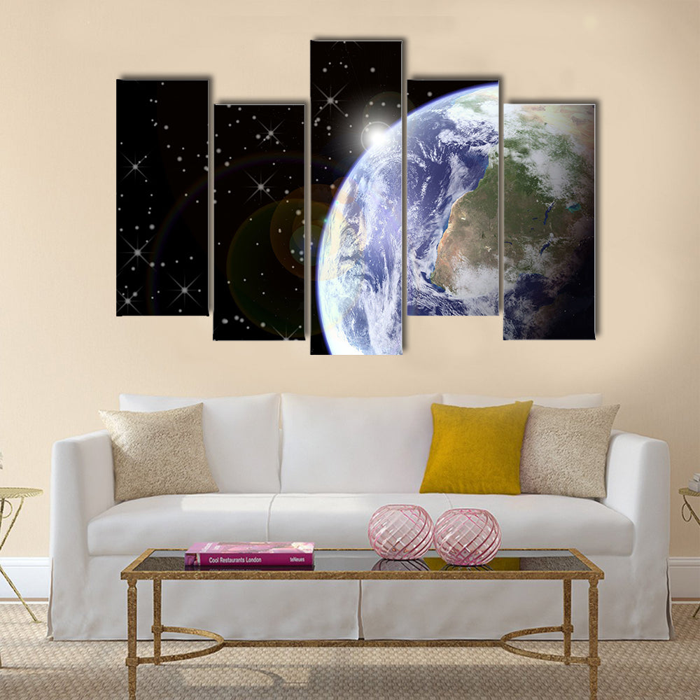 Sunrise from space. Sunburst behind the earth, generated in PS. Earth and stars seen clearly at 100% Multi Panel Canvas Wall Art