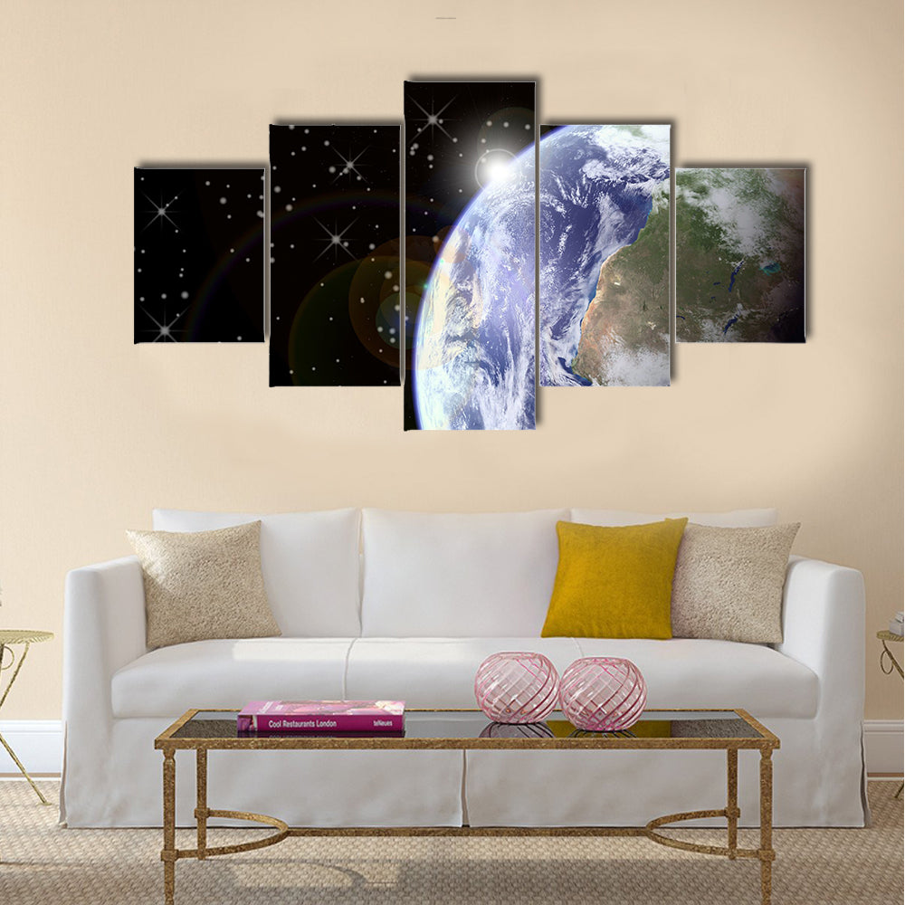 Sunrise from space. Sunburst behind the earth, generated in PS. Earth and stars seen clearly at 100% Multi Panel Canvas Wall Art