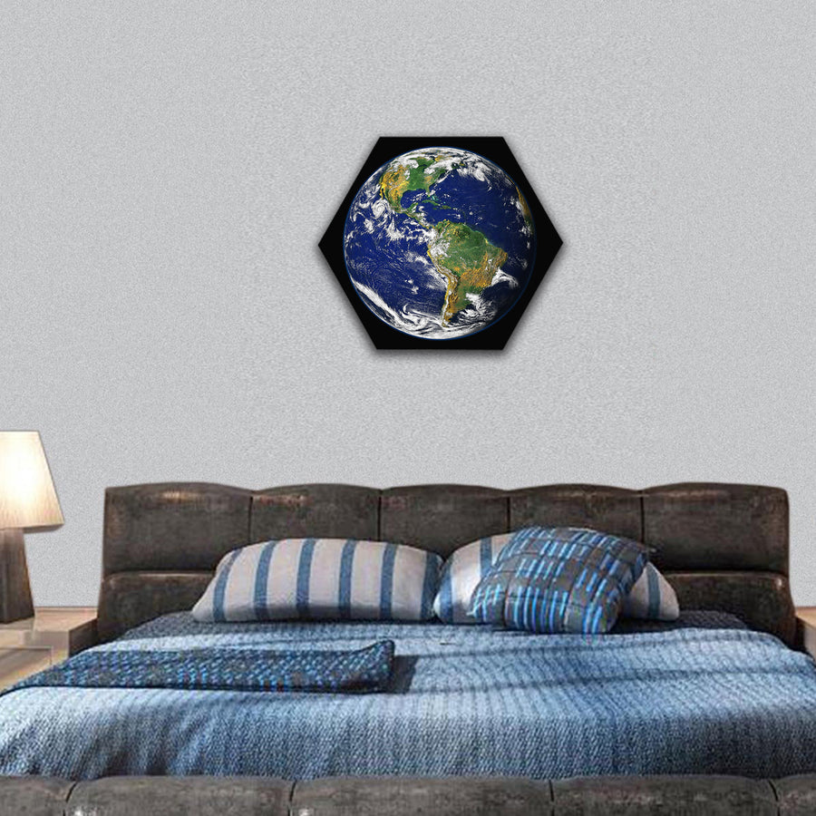 Earth, with a glowing blue atmosphere, moon in a frame hexagonal canvas wall art