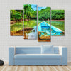 Old boat in tropical river, perfect place for fishing, Multi panel canvas wall art