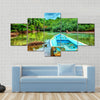 Old boat in tropical river, perfect place for fishing, Multi panel canvas wall art