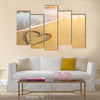 Heart drawn on the sand of a sea beach, soft wave and solar glare Multi panel canvas wall art