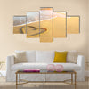 Heart drawn on the sand of a sea beach, soft wave and solar glare Multi panel canvas wall art