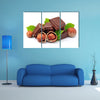 Chocolate with hazelnuts closeup Multi panel canvas wall art