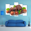 Chocolate with hazelnuts closeup Multi panel canvas wall art