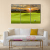 Golf ball on green Multi Panel Canvas Wall Art